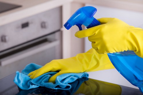 Technician using carpet cleaning equipment on a floor