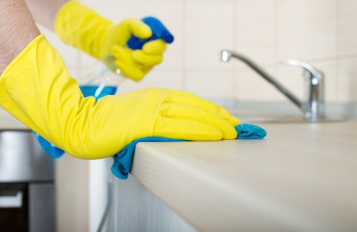 Person blotting a fresh spill during stain removal